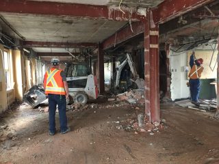 Interior stripping of the building before structural demolition; light weight equipment and adequately protected workes used