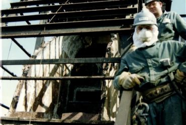 Picture of two employees at the base of the stack.