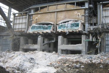 Inside a partially demolished building showing a section of an oven and solidified residual glass one meter thick