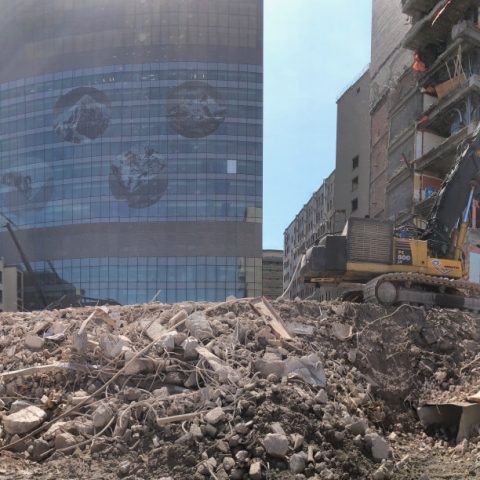 Long reach excavators used to access tall buildings