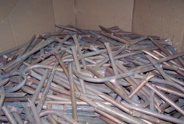 Old copper tubing in a corrugated box at Centrem recycling center in Alma