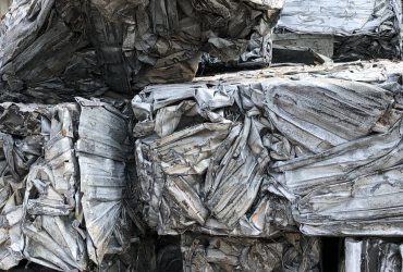 Bale of steel building siding after baling – Bushelling #1, piled outside Centrem recycling enter in Alma