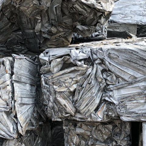 Bale of steel building siding after baling – Bushelling #1, piled outside Centrem recycling enter in Alma