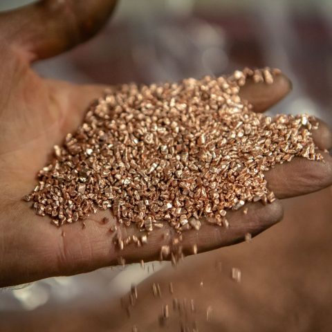 A handfull of copper granules produced at Centrem recycling center in Alma