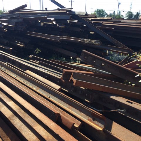 A pile of rail track ready for recycling