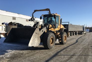 Wheel loader at moving around Centrem property in Alma