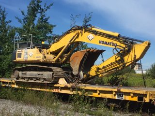 VPC 400 excavator loaded on a rail car