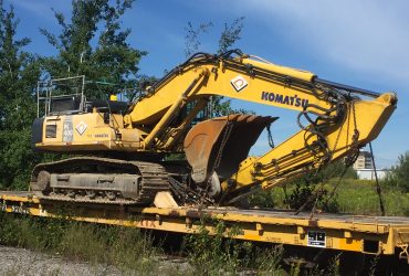 VPC 400 excavator loaded on a rail car