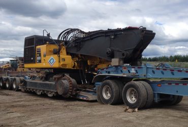 PC 800 excavator loaded on a low deck trailer